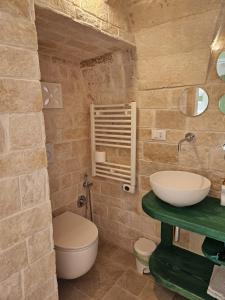 a bathroom with a sink and a toilet at Stanza29 in Martina Franca