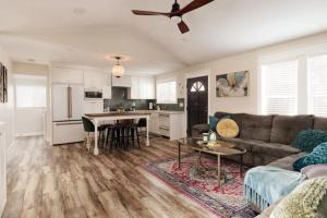 a living room with a couch and a table at Charming Home Downtown Paso Robles in Paso Robles