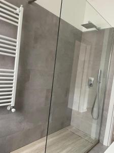 a shower with a glass door in a bathroom at Domus de Silvi in Silvi Marina