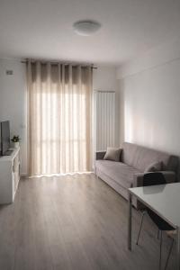 a living room with a couch and a table at Domus de Silvi in Silvi Marina