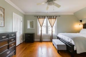 a bedroom with a bed and a ceiling fan at Iconic Modern Farmhouse in San Luis Obispo