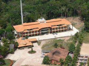 an aerial view of a large building with an orange roof at Samaúma Park Hotel in Barcarena