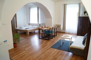 a living room with a bed and a table at Apartment Porta in Terezín +56 photos