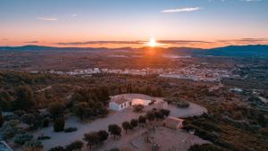 an aerial view of a city at sunset at L'Albea Hotel Rural in Vall dʼAlba