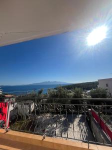 a view of the ocean from a balcony at Dub Hostel Saranda in Sarandë