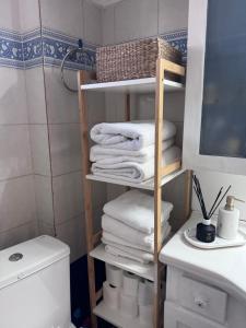 a bathroom with a towel rack with towels at SugarV Home in Kilkis