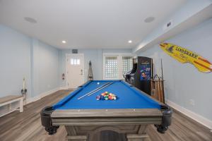 a room with a pool table in the middle of it at 2934 - Seas the Day in Duck