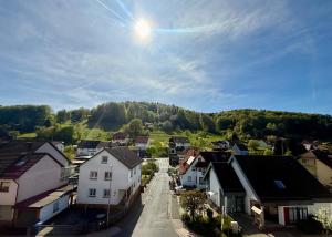 a small town with houses and a mountain at Spessart Escape - Ihr stilvoller Rückzugsort im Herzen des Spessarts in Mespelbrunn