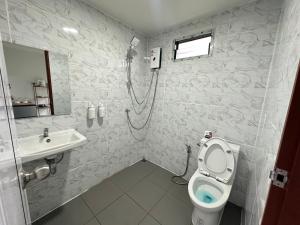 a bathroom with a shower and a toilet and a sink at Heaven Khaokho2 in Khao Kho