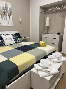 a bedroom with a large bed and a dresser at Midnight Sun in Vietri sul Mare