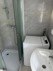 a small bathroom with a toilet and a sink at Comfort Days in Gladno Polje +10 photos