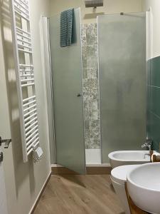 a bathroom with a shower and a toilet and a sink at Midnight Sun in Vietri sul Mare