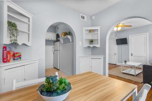 a kitchen and dining room with a wooden table at Natural Sabbatical 1 Bedroom Apartment in Dallas