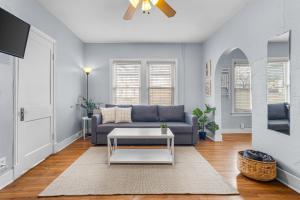 a living room with a couch and a table at Natural Sabbatical 1 Bedroom Apartment in Dallas