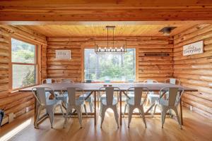 a dining room with a table and chairs at Shimmering River Retreat in Edgecomb +30 photos