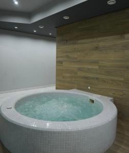 a large jacuzzi tub in a room at Hotel Elion in Yerevan