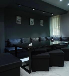 a living room with a couch and a table at Hotel Elion in Yerevan +26 photos