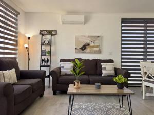 a living room with a couch and a coffee table at House Ayala 2BR 2Bd in Rosarito +17 photos