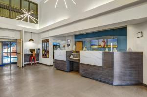a lobby with a reception desk in a building at Prairie Crest Red Deer by IHG in Red Deer