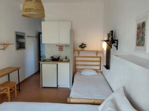 a small kitchen with a couch and a table in a room at Apartmani Tia in Neum +52 photos