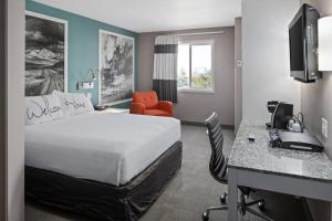 a hotel room with a bed and a desk at Prairie Crest Medicine Hat by IHG in Medicine Hat +55 photos