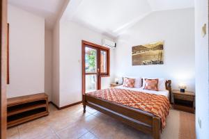 a bedroom with a bed and a window at Hotel Dubrava in Budva +28 photos