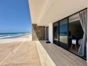 an empty room with a view of the ocean at Little Pearl Sea View Studio in San Antonio del Mar