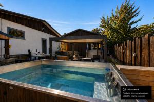 a swimming pool in the backyard of a house at Alp Studios Apartment 1 in Wanaka
