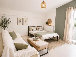 a living room with a bed and a couch at Panorama View in Kalamata