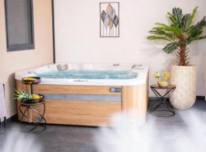 a bath tub in a room with a potted plant at Lux Mobile Homes Vodice in Vodice +65 photos