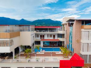 an aerial view of a building with a swimming pool at Hotel Nilas in Tarapoto