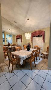 a dining room with a large table and chairs at Accessible-Friendly Pool Retreat Extended Stay Welcome in Valrico