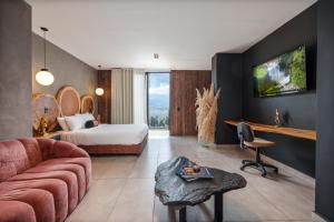 a large hotel room with a bed and a desk at Hotel Zelva Negra in Medellín +72 photos