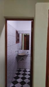 a bathroom with a sink and a mirror at Tinkunaco in Purmamarca