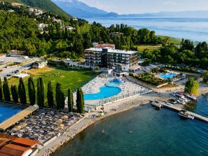 an aerial view of a resort on the water at Lungolago Apartment Ohrid in Ohrid