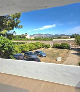 a view of cars parked in a parking lot at Villa Los Naranjos in Carcaixent