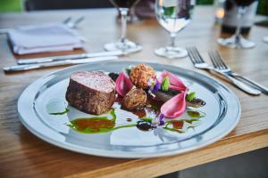 a plate of food on a wooden table at Skjolden Hotel in Skjolden