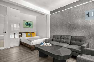 a living room with a couch and a bed at Balandras Beach Stay 3 Beach & Pool Access in Dorado