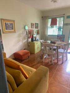 a living room with a couch and a table and chairs at Apartamento Turístico Frailejones in Duitama