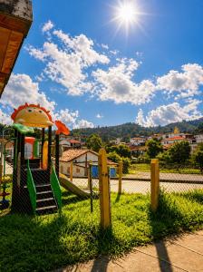 a playground in a park with the sun in the sky at Salento verde in Salento