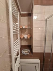 a small staircase with a plate of food in a bathroom at Blue Serenity in Nea Vrasna +17 photos