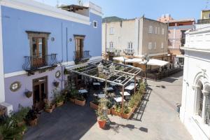 an overhead view of a building with tables and chairs at Case Vacanze Albamarina in Lipari