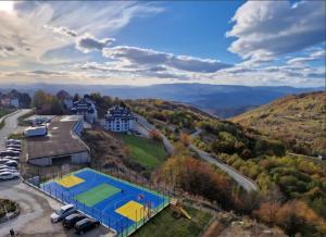 an overhead view of a tennis court on a hill at Kopaonik Mountain Retreat in Cajetina