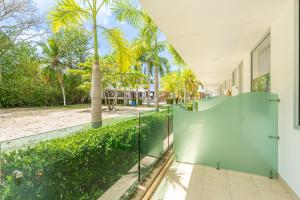 an external view of a house with a glass wall at Cabañas La Fragata Coveñas in Coveñas +98 photos
