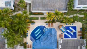 an aerial view of a resort with a swimming pool at Cabañas La Fragata Coveñas in Coveñas