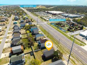 an aerial view of a city with a highway at 5085 - Knapp's at the Beach in Kill Devil Hills