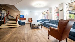 a living room with a couch and a table at Hotel Mariscal in Mexico City