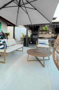 a living room with two couches and a table at Sweet Home Away from yours in Lagoa Santa