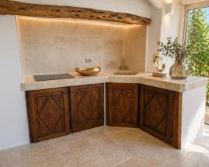 a bathroom with a sink and a counter with a bowl at Porto Cervo Sea and Nature Villa in Porto Cervo +37 photos