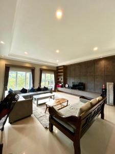 a large living room with a couch and a table at Al Andalus Resort Puncak in Puncak